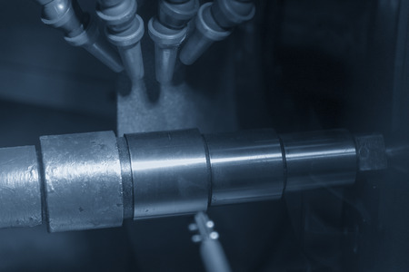 The CNC cylindrical grinding machine making the  shaft part. Automotive part manufacturing process.の写真素材