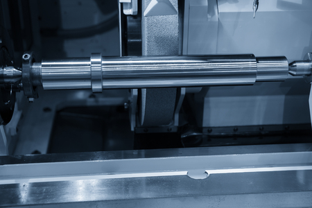 The CNC cylindrical grinding machine making the  shaft part. Automotive part manufacturing process.の写真素材