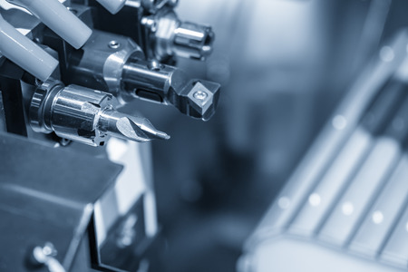 Close-up of the cutting tools magazine of the multi-function CNC lathe machine.Center drill tools at the CNC turning machine.の写真素材