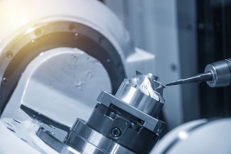 The 5-axis CNC milling machine cutting   aerospace  part with the solid ball endmill tool. The Hi-Technology manufacturing process.の写真素材