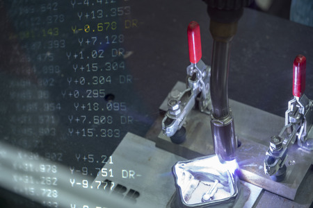 The abstract scene of welding robotic addition material at the work pieces with the coordinate data...