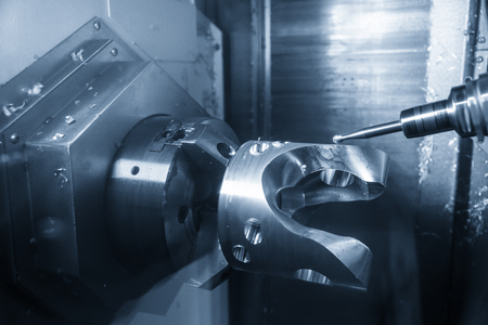 The  5-axis CNC machining center  cutting the automotive part with solid ball end mill. The hi technology manufacturing process of automotive parts.の写真素材