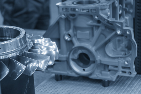 The impeller parts with the cylinder block background. The boats engine manufacturing concept.の写真素材