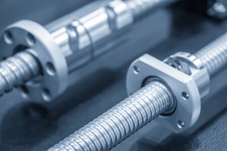 The lead screw spare parts of CNC machine in close-up scene. The hi-precision parts of CNC machine manufacturing process.の写真素材