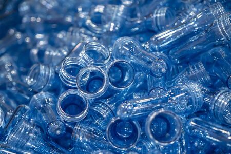 The pile of preform shape for plastic bottle blowing process. The raw material of PET bottle manufacturing process.の写真素材