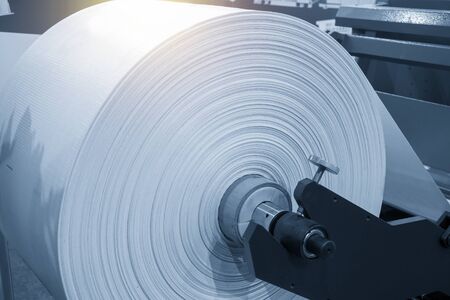 The roll of material for plastic bag manufacturing process. The plastic bag in the roll.の写真素材