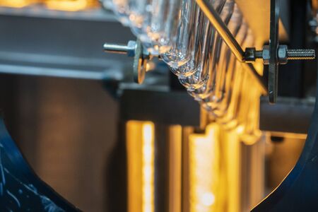 The preform shape of plastic bottle in the heater. The PET bottle manufacturing process.の写真素材