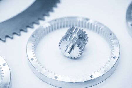 Close-up of the planetary gear parts on the white background. The automatic transmission gear parts.の写真素材