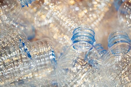 Close up scene pile of PET bottles products on the container box. The drinking water bottles manufacturing process concept.の写真素材