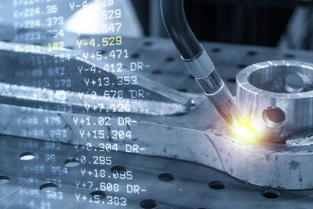 The abstract scene of robotic arm welding machine and the coordinate data background. The hi technology automotive parts manufacturing process by robotic system for  welding machine.の写真素材