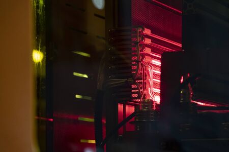 The preform shape of drinking bottles after heating process on the production line to the automatic blowing machine. The operation of PET bottle processing by blowing process with the blowing mold.の写真素材