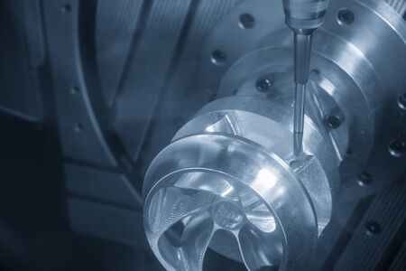 The  5-axis CNC milling machine  cutting the hi-precision automotive  by solid ball endmill tools. The hi technology of impeller parts manufacturing process by 5-axis machining center.の写真素材
