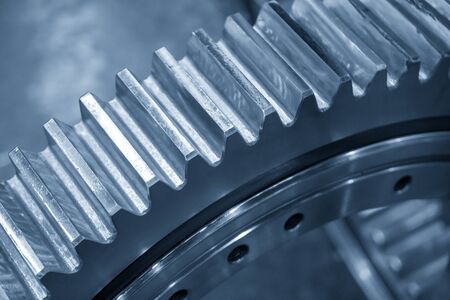 The close-up scene of the pinion gear in the light blue scene. The mechanical parts manufacturing process concept for automotive industrial .の写真素材