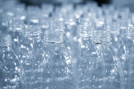 The stock of the PET bottles in the warehouse  waiting for drinking water manufacturing process. The...