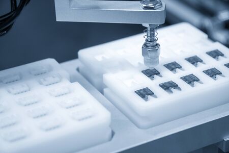 The hi-technology  material handing process by robotics system. The hi-technology electronics manufacturing  process control by computer system.の写真素材