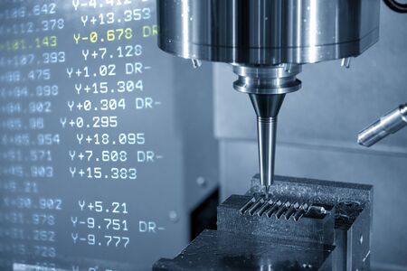 The abstract scene of the G-code data  and the CNC milling machine cutting the injection mold parts with solid ball endmill tools. Hi-precision  mould and die production process by machining center.の写真素材