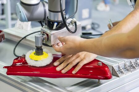 The engineer setup and teaching  the automatic polishing robotic system in the automotive assembly...
