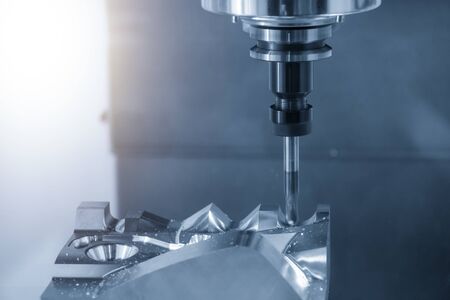 The CNC milling machine rough cutting  the injection mold parts by  solid ball  endmill tools. The mold and die manufacturing process by machining center with the solid carbide endmill tools.の写真素材