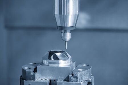 The  CNC  milling machine cutting  the mold parts by solid endmill tool. The hi-precision mold and die manufacturing concept by machining center.の写真素材