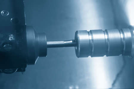 The CNC lathe machine bore cutting the metal pulley parts . The hi-technology metal working...