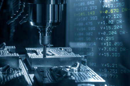 Abstract scene of CNC milling machine and G-code data background. The hi-technology mold and die manufacturing concept by machining center.の写真素材