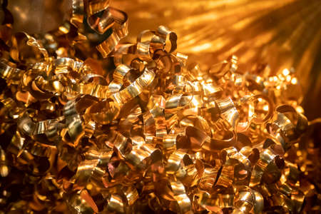 Close up scene of curling chip  of  brass material . The scrap turning process form CNC lathe machine.の写真素材