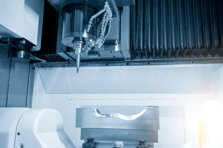 The hi-precision 5-axis machining center cutting the rubber mold parts. Hi-technology  mold and die...