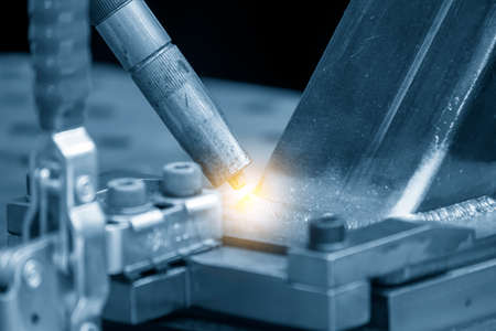 The abstract scene of laser welding machine with lighting effect. The hi-technology welding process...
