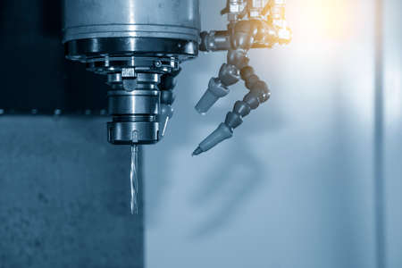 The machine reamer tool attached on the spindle of CNC milling machine. The hi-precision metalworking by machining center.の写真素材