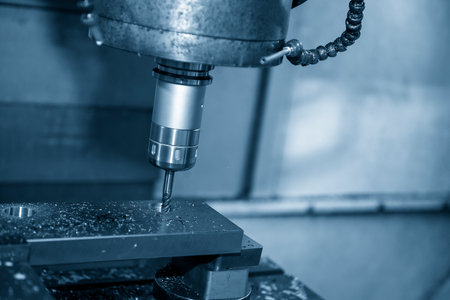 The  CNC  milling machine cutting  the mold parts by solid ball  end-mill tool. The hi-precision mold and die manufacturing concept by machining center.の写真素材