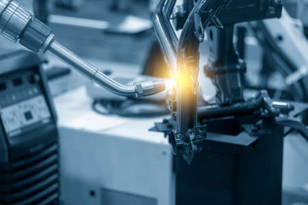 The welding robot working with motorcycle parts assembly processing. The industrial 4.0 automotive...