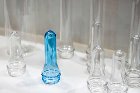 The sample parts injection preform shape of PET bottle products. The plastic bottle manufacturing process concept.の写真素材
