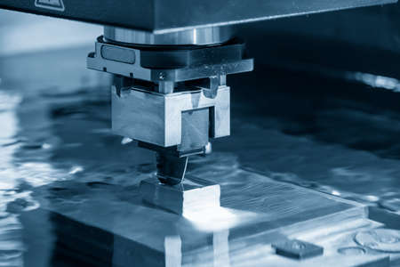 The operation of EDM machine with graphite electrode materials. Mold and die manufacturing process...