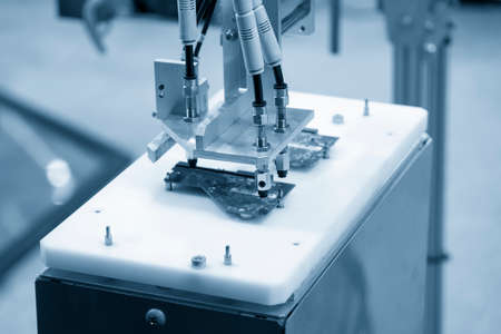 The hi-technology  material handling circuit board parts production line by robotic system. The automatic pneumatic robotic arm picking the computer parts in production line.の写真素材