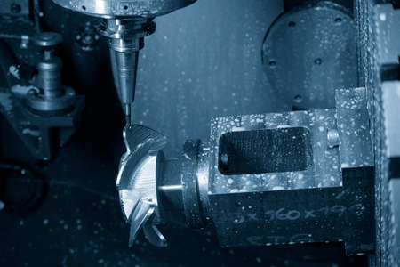 The  5-axis  machining center cutting the propeller parts with solid ball end mill tool. The hi-precision automotive manufacturing process by multi-axis CNC milling machine.の写真素材