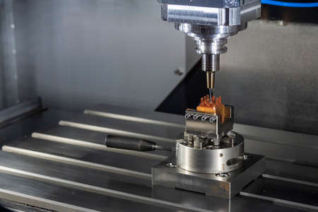 The CNC milling machine cutting the  copper electrode parts with solid ball end mill tools. The mold...