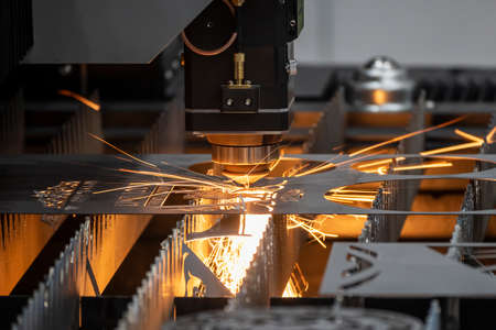 Close up scene fiber laser cutting machine cutting  machine cut the metal plate. The hi-technology...