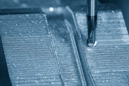 Closeup scene the press die manufacturing process by CNC milling machine with ball end mill tool....