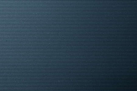 The horizontal line pattern on the rough gray surface. The texture background with lighting effect.