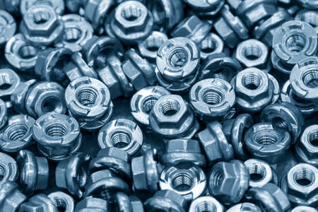 The pile of galvanize special hexagon nuts with anti loos washer. The construction parts manufacturing concept.の写真素材