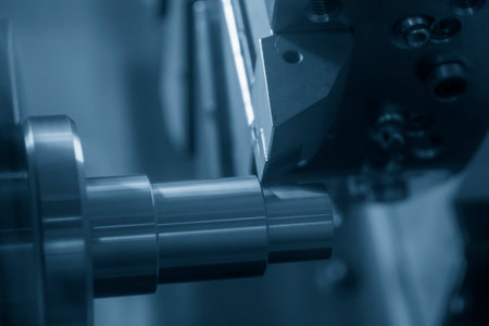 The  CNC lathe machine forming  cutting the metal shaft parts. The hi-technology metal working...
