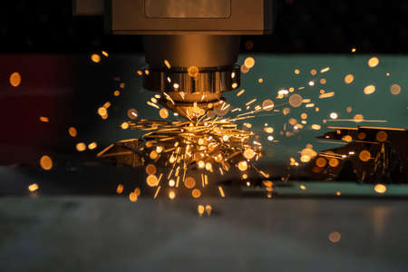 The fiber laser cutting machine cutting  machine cut the metal plate. The hi-technology sheet metal manufacturing process by laser cutting machine.の写真素材