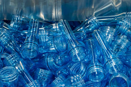 The close up scene of group of preform shape of PET bottle products. The raw material for plastic...