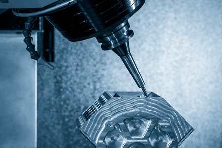 The 5-axis machining center cutting the V8 engine cylinder block with solid ball end mill tool. The hi-precision automotive manufacturing process by multi-axis CNC milling machine.の写真素材