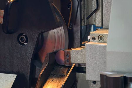 The operation of band saw cutting machine cutting the metal shaft parts. The machine tool for...