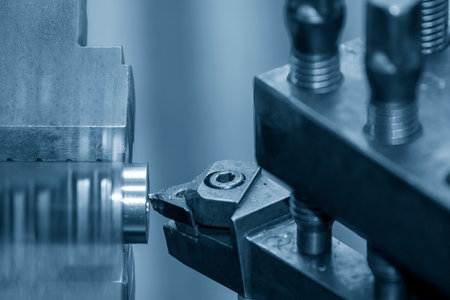 Closeup scene the lathe machine finish cut the metal parts. The metalworking process by turning...