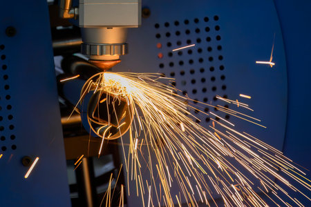 Close up scene the fiber laser cutting machine cutting  machine cut the stainless steel tube. The hi-technology sheet metal manufacturing process by laser cutting machine.の写真素材