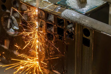 Closeup scene the wire EDM machine cutting the mold insert parts with the sparkling light. The die...