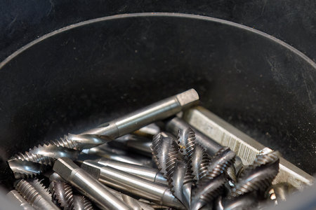 Close up scene  the used machine tapping tool. The threading tool concept on machining center.の写真素材