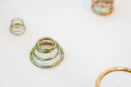 Close up  the cone shape coil spring parts with white background. The hi-technology manufacturing concept.の写真素材